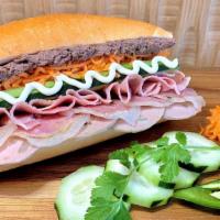 Combo Bahn Mi · Vietnamese sausage, curved pork, and ham with pickled carrots, fresh cucumber, cilantro, and...