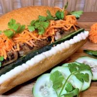 Grilled Chicken Banh Mi · Grilled, house-marinated chicken with pickled carrots, fresh cucumber, cilantro, and jalapeñ...
