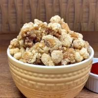 Popcorn Chicken · Deep fried, crispy chicken bites tossed with savory seasoning.