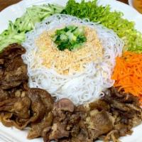 Grilled Pork Vermicelli · Grilled, house-marinated pork on a bed of vermicelli noodles and sliced vegetables. Served w...