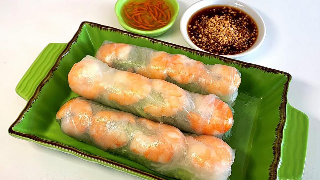 Shrimp Fresh Spring Roll · White shrimp with fresh mint leaves, lettuce, and Vermicelli noodles wrapped in rice paper. Served with your choice of hoisin and peanut dipping sauce or Vietnamese fish sauce.