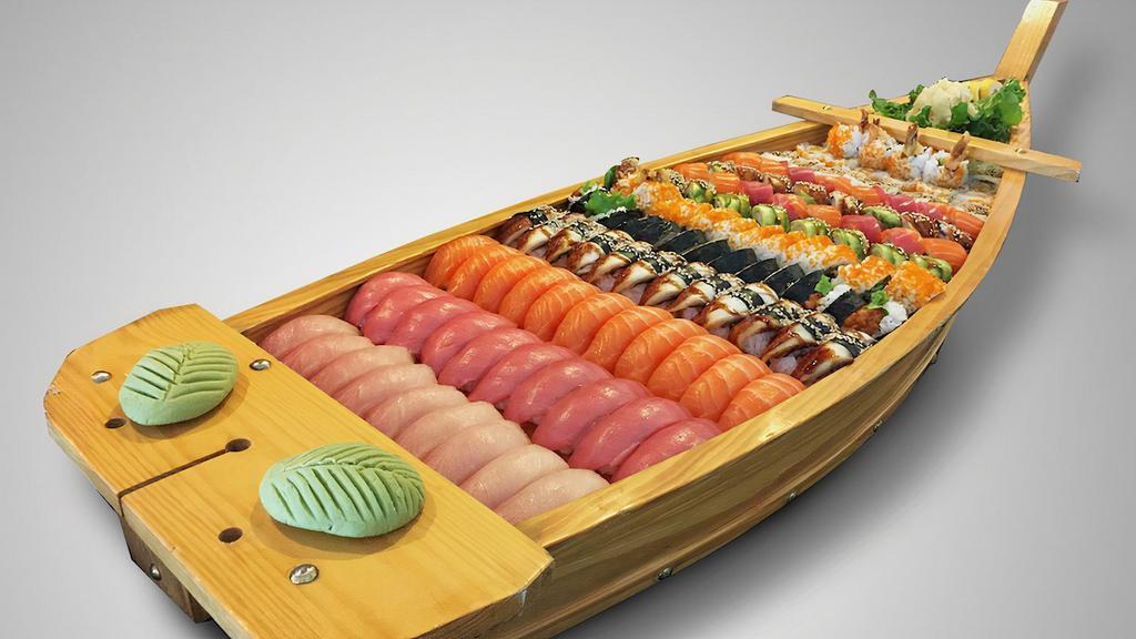 Sushi Boat · 9 pcs hamachi nigiri, 10 pcs maguro nigiri, 11 pcs sake nigiri, 12 pcs unagi nigiri, 1 dragon roll, 1 caterpillar roll, 2 spider rolls, 2 rock & roll, 2 spicy tuna rolls, 2 gold gate rolls, 2 49ER roll. Serving for 8-10.