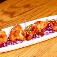 Jomsom Cauliflower · Vegetarian. Gluten free. Crispy cauliflower florets tossed in a spicy soy and tangy sauce.