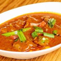 Gorkhali Goat Curry · Vegetarian. Gluten free. Bone-in goat meat cooked with ginger, garlic, onion, and Himalayan ...