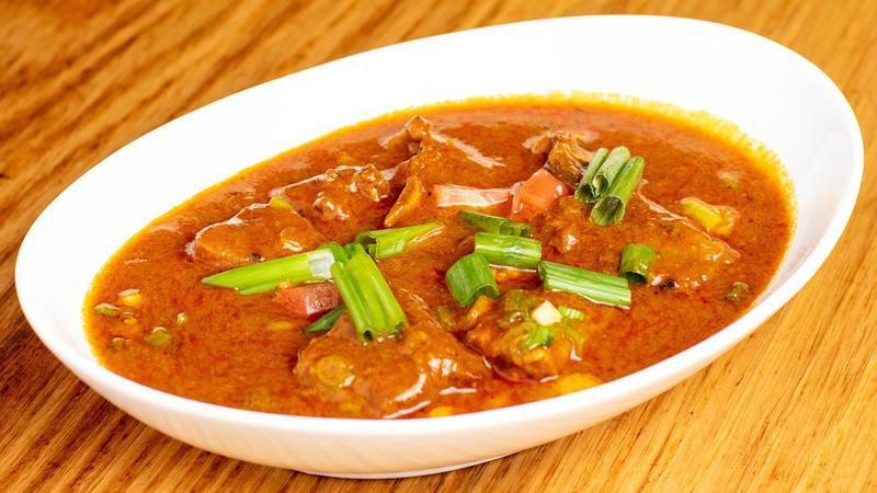 Gorkhali Goat Curry · Vegetarian. Gluten free. Bone-in goat meat cooked with ginger, garlic, onion, and Himalayan spices.