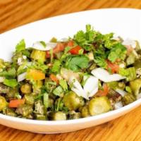  Okra Masala · Vegetarian. Gluten free. Fresh cut okra cooked with chopped onions, tomatoes and spices.