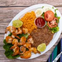 Camarones a La Plancha · Grilled shrimp served with rice, beans and salad.