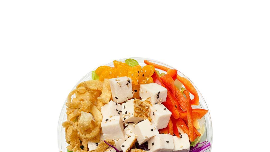 Asian Chicken Salad · Romaine, bell pepper, mandarin oranges, red cabbage, shredded carrots, diced chicken, asian sesame dressing, wonton strips, sesame seeds, green onion.