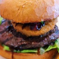 The Cowboy · A third-pound Angus beef patty topped with an onion ring stuffed with chopped, pulled pork r...