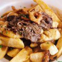 Beef Short Rib Poutine · Our classic poutine with the addition of braised beef short rib and crispy onion strings.