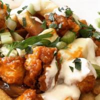 Buffalo Chicken Poutine · Our classic poutine with the addition of fried chicken tenders in buffalo sauce, with blue c...