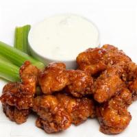 WingNutz · Twelve crispy tender boneless wings, tossed in your favorite sauce or rub, and served with b...