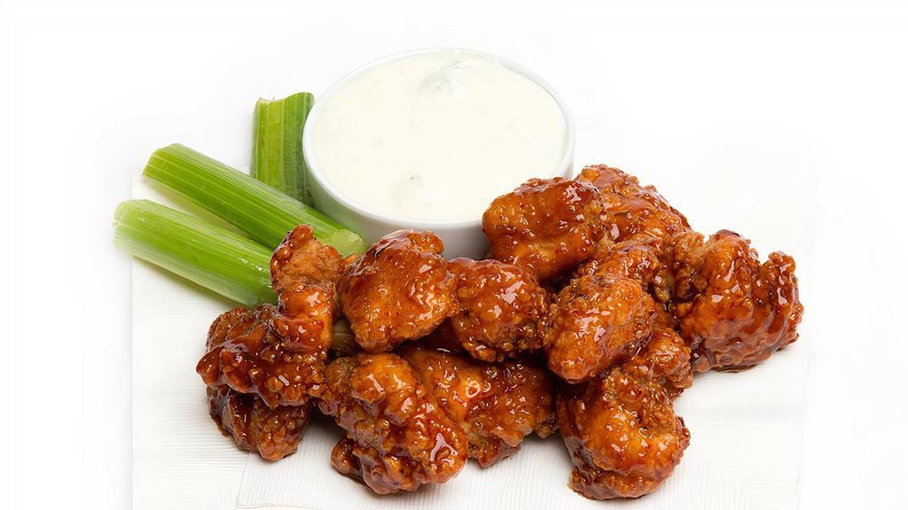 WingNutz · Twelve crispy tender boneless wings, tossed in your favorite sauce or rub, and served with blue cheese dip, and carrots and celery