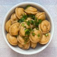 Salmon Pelmeni · salmon, green onion, parmesan, paprika colored dough.
Broth and toppings available as add on