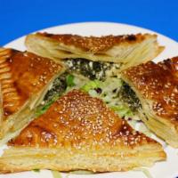 7. Spanakopita · Spinach, feta cheese, wrapped in puff pastry and baked.