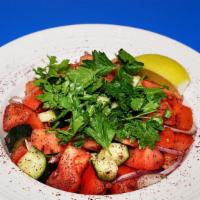 14. Shepherd Salad · Tomatoes, cucumbers, onions, parsley, lemon, olive oil & sumac.