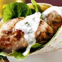 Kofte Wrap · Char-grilled grounded lamb & beef, parsley, red onions, garlic & spices with salad and tahin...