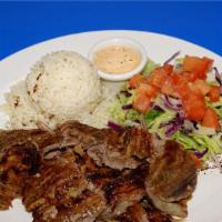 25. Lamb Beef Gyro Plate · Slow-cooked, thin-sliced, marinated lamb and beef. Comes with salad, rice, and pita bread.