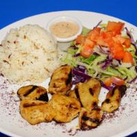 27. Chicken Shish Kebab · Char-grilled skewer of marinated chicken chunks. Comes with salad, rice, and pita bread.