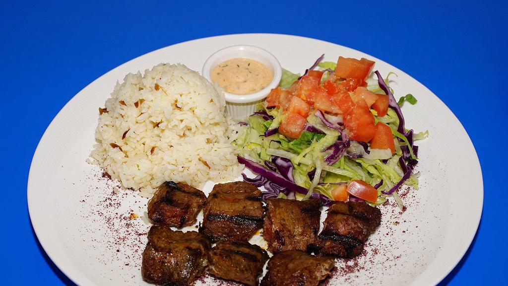 29. Beef Shish Kebab Plate · Char-grilled skewer of marinated beef chunks. Comes with salad, rice, and pita bread.