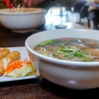 2.  Phở Đặc Biệt Bò Viên (Large) · Special combo with rare thin slices of steak, well-done brisket, flank, tendon, tripe & beef...