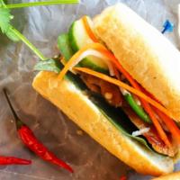 Tofu Banh Mi · Vietnamese Sandwich served with pickled vegetables, Thai basil, housemade mayo on a toasted ...