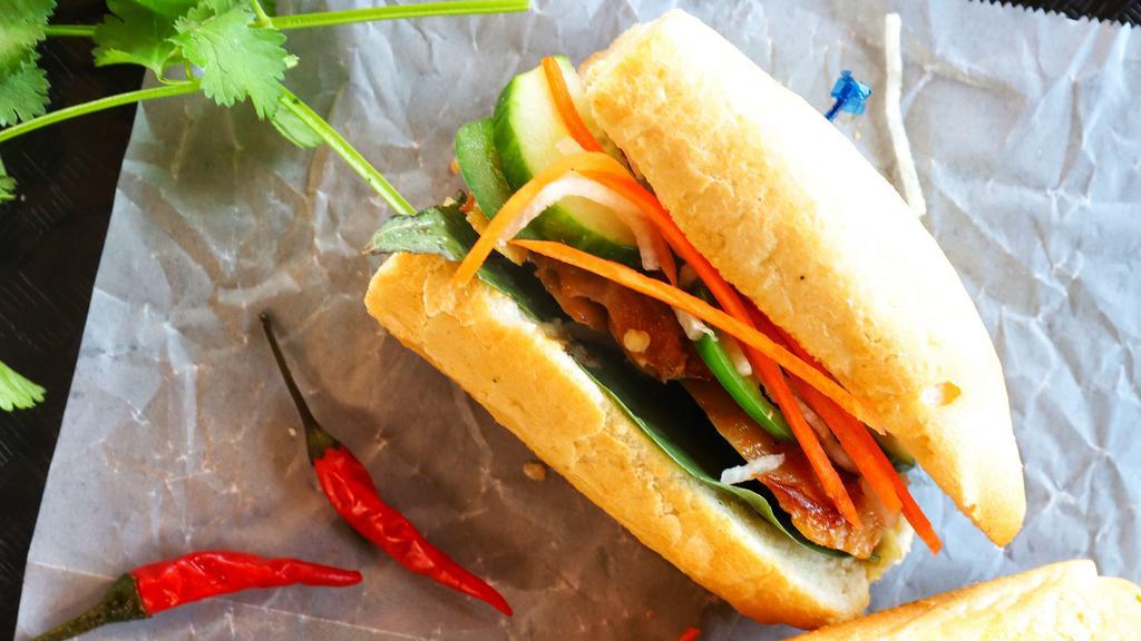 Tofu Banh Mi · Vietnamese Sandwich served with pickled vegetables, Thai basil, housemade mayo on a toasted baguette. Served with kettle chips