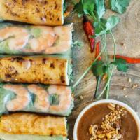 Spring Rolls · 4 PC Shrimp and pork belly with vermicelli noodles wrapped with fresh herbs in rice paper. 
...