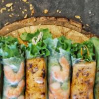 Grilled Salmon Rolls · 4 PC grilled salmon belly and vermicelli noodles wrapped with fresh herbs in rice paper. 
Se...