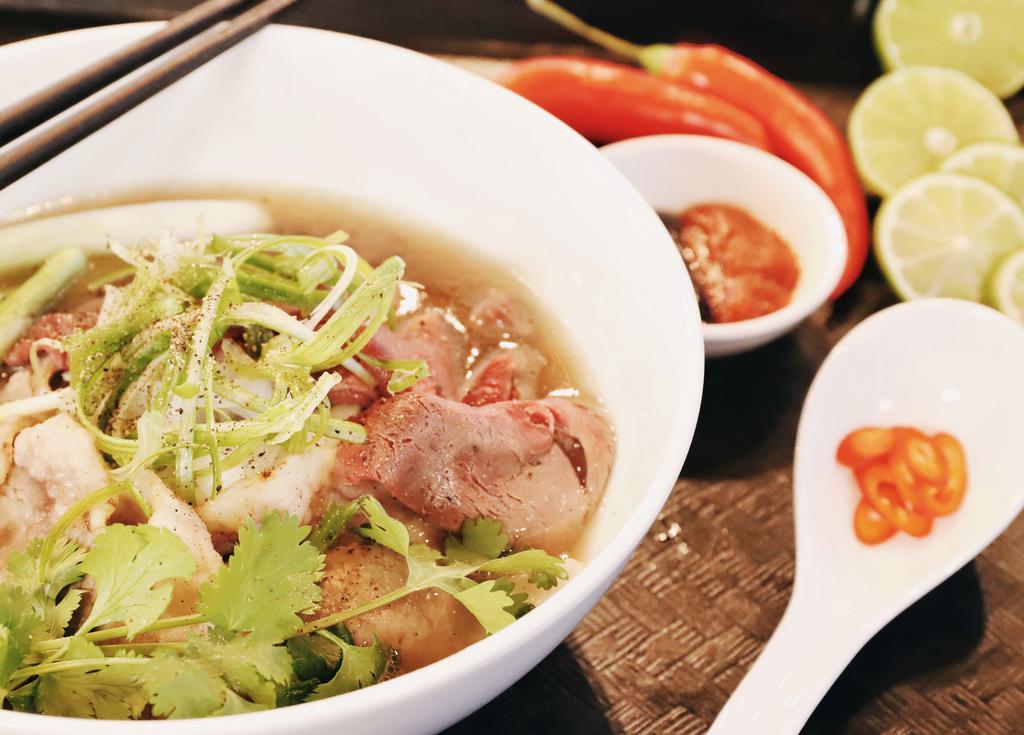 Pho Dac Biet · Housemade beef broth with sliced filet mignon, meatballs, tendon, and choice of fatty or lean brisket.