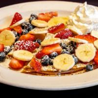 Fruit Crepes Breakfast · Three crepes with seasonal fresh fruit and whipped cream. No home-fries.