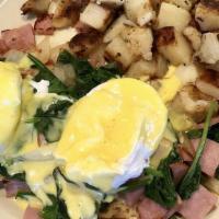 Costa Del Sol · Sauteed ham, spinach and onions with poached eggs on an English muffin with hollandaise sauce.