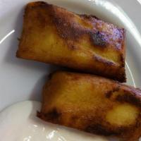 Yuca Frita Con Chicharron · Fried cassava served with a mixed salad of chopped cabbage, tomatoes, radish, and lemon juic...
