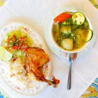Sopa de Gallina India · Traditional Salvadorean hen soup. Grilled hen served on the side with rice and a salad (Ital...