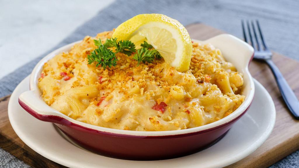 Crab Mac · The Old Bae is back! 🦀 Rock crab, Gouda, pecorino, caramelized shallots, Old Bay seasoning and garlic butter, topped with crispy breadcrumbs and lemon.