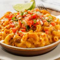 Heat-at-Home Mexican Chorizo Mac · Spicy chorizo, Monterey Jack and chipotle adobo, topped with cilantro and lime. Serve within...