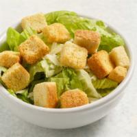 Side Caesar Salad · A smaller version of our Caesar salad. Crisp romaine, crunchy croutons, salty Pecorino and h...