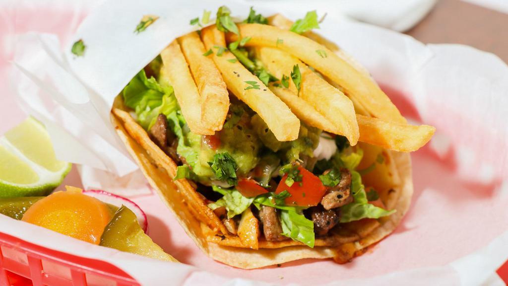 Top Shelf Taco · Choice of meat, crispy and soft tortillas with melted cheese, smear of refried, sour cream, pico de gallo, sliced avocado and shredded iceberg lettuce topped with house  fries.