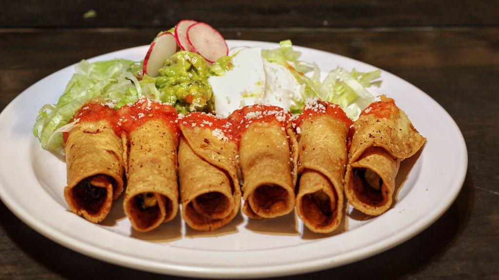 Taquitos (6 pieces) · 3 ham and Cheese crispy tacos served with a side of sour cream, guacamole and sweet salsa.