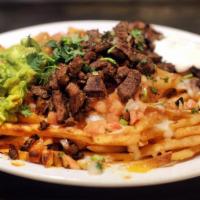 Asada Fries · Carne asada over house steak fries with blended cheese, drizzle of refried beans, guacamole,...