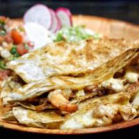 Garlic Shrimp and onion Quesadilla · Garlic grilled Shrimp with caramelized onions, blended cheese in a 12