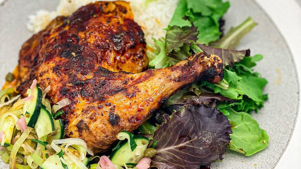 Leg Quarter Chicken · Our famous ancho-mustard rubbed 38 north chicken. Served with a crunchy salsa verde, adobo buttermilk slaw and jasmine rice. Substitute spring greens for rice at no charge. 
Gluten free.