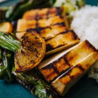 Grilled Tofu · Hodo tofu in a spicy paprika marinade. Served with seared shishitos, crunchy salsa verde, an...