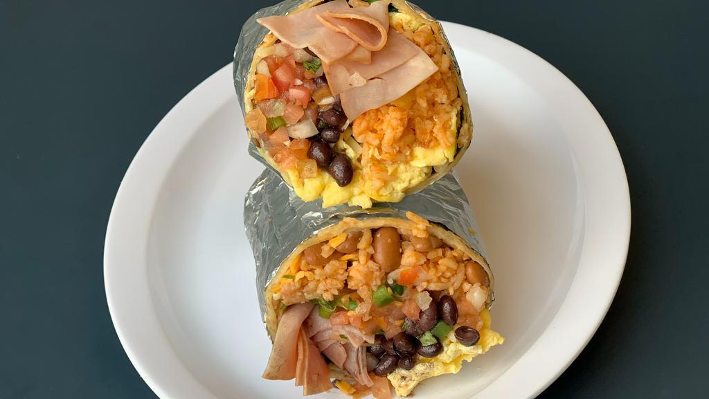 Scrambled Eggs with Ham, Home Fries, Black Beans, and Pico De Gallo Burrito · Sometimes the simplest things are the best.