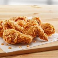 Cajun Fried Chicken Wings · Golden-crispy fried chicken wings dipped in tangy cajun sauce.