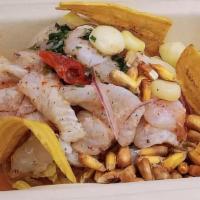 Ceviche · Fresh fish in lime juice, peruvian corn, sweet potato, aji rocoto, leche de tigre with guarn...