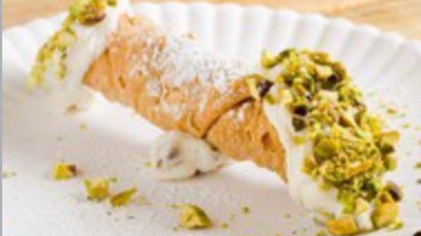 Cannoli · House-made Cannoli Shell, Chocolate Chip packed Sweet Ricotta Cream, topped with Pistachios and Powdered Sugar.