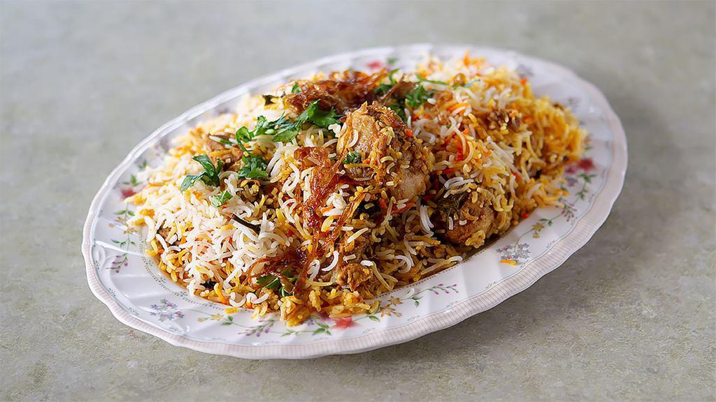 R1. Hyderabadi Dum Biryani · Chicken cooked with exotic spices and saffron flavored basmati rice.