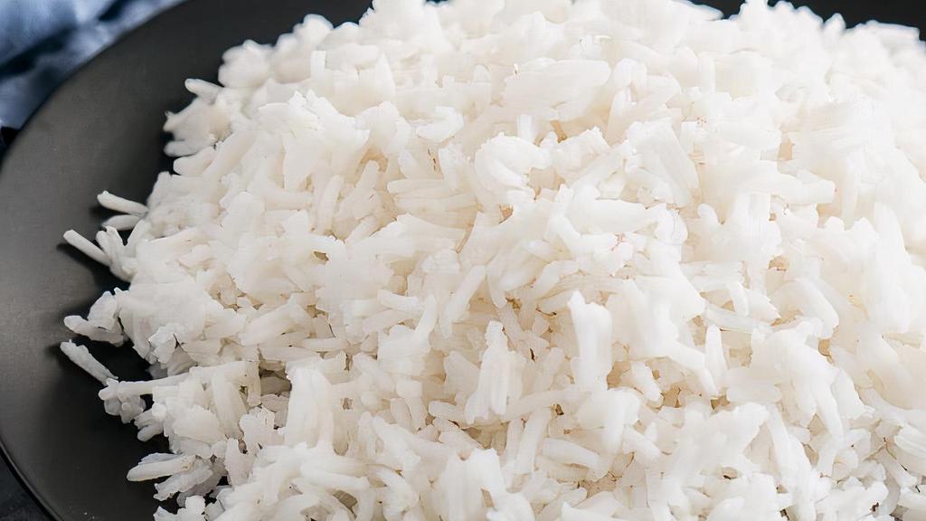 R4. Rice (Pulao) · Cooked with brown onion, clove and saffron marbled basmati rice.
