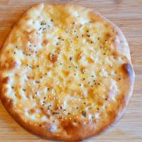 Rogani Naan · Flat leavened on the wall lining of tandoor oven with sesame seeds.